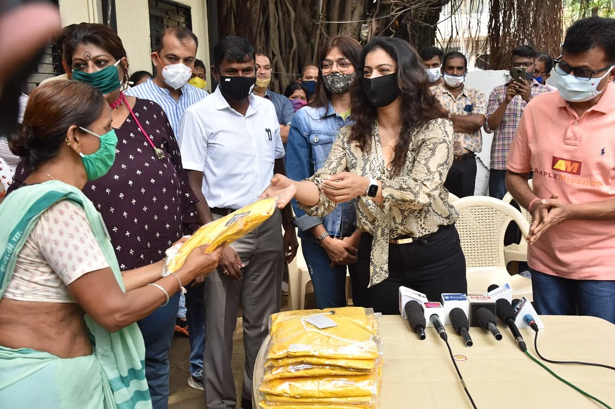 Watch: Kajol requests paparazzi to maintain social distancing as she steps out in Mumbai to distribute raincoats to BMC employees