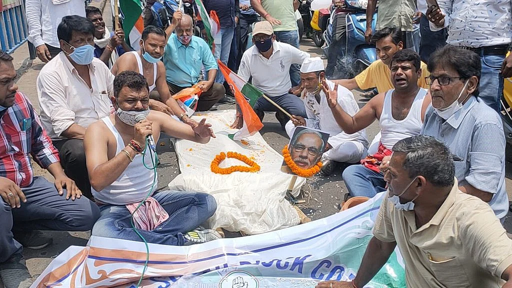 Congress workers stage protests against the constantly rising fuel prices in Asansol, West Bengal on Wednesday, July 7, 2021.