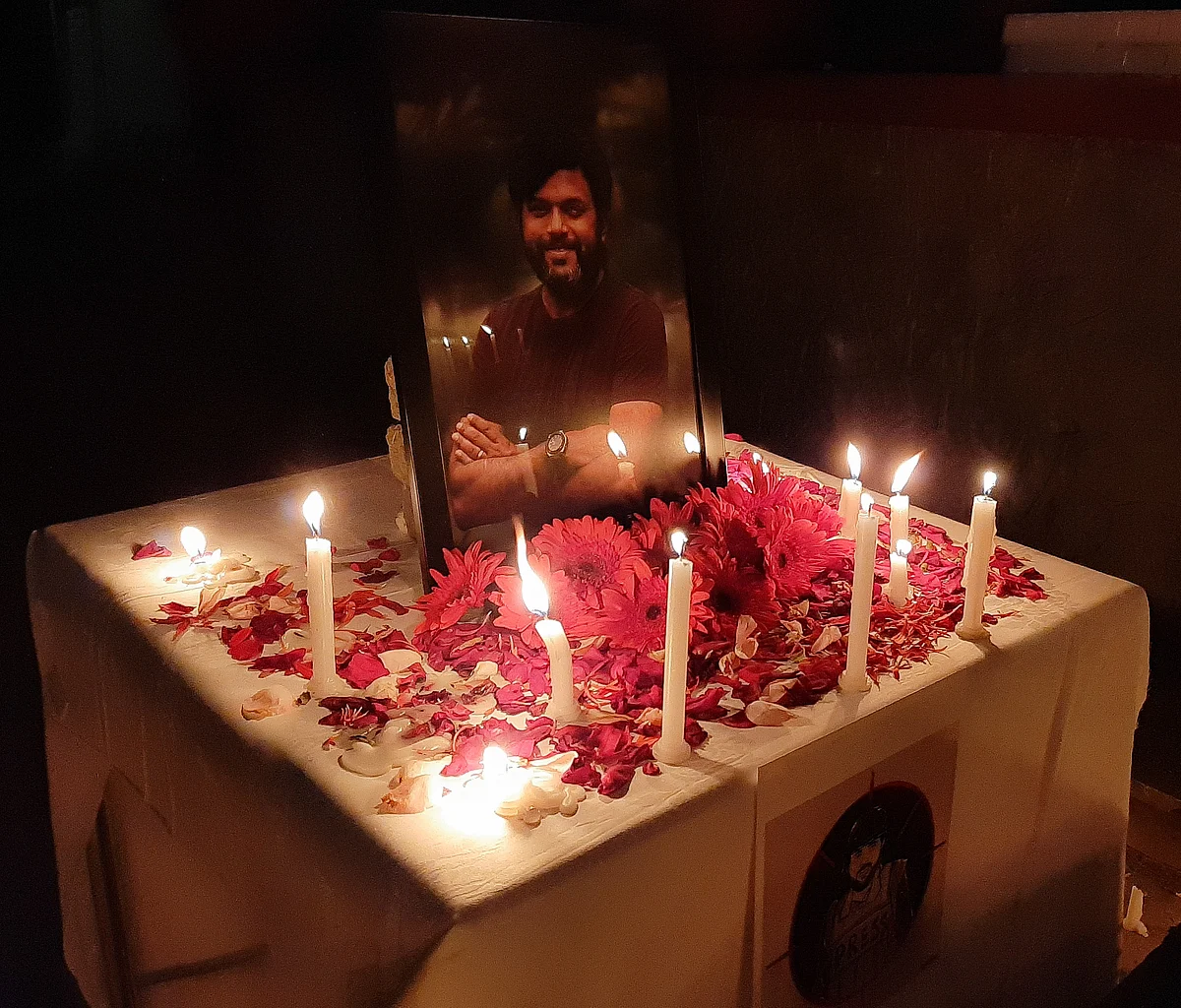 Candles are placed by journalists next to the portrait of Indian photojournalist Danish Siddiqui as a tribute inside the Kashmir Press Club in Srinagar, Jammu & Kashmir on July 18, 2021.