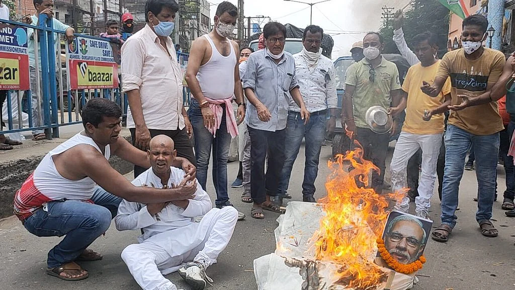 Congress workers stage protests against the constantly rising fuel prices in Asansol, West Bengal on Wednesday, July 7, 2021.