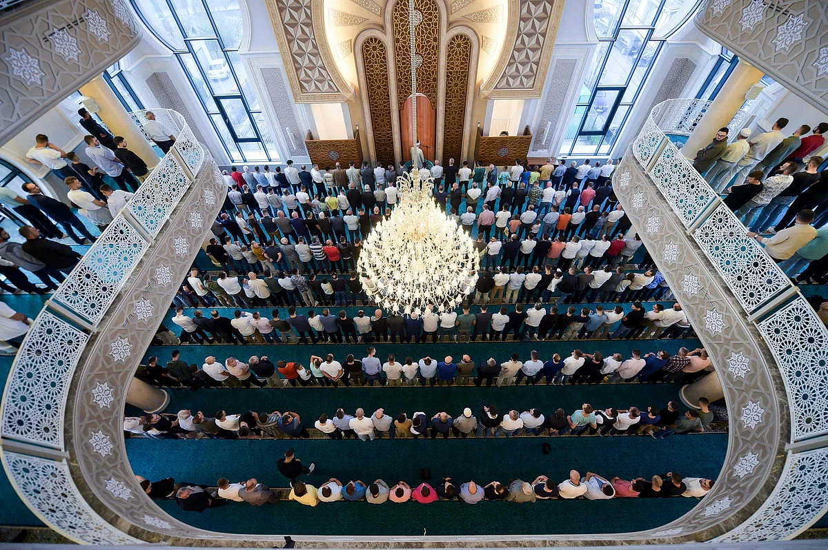 Muslim believers pray at a mosque near Pristina, Kosovo,on July 20, 2021, during the sacrificial Eid al-Adha festival