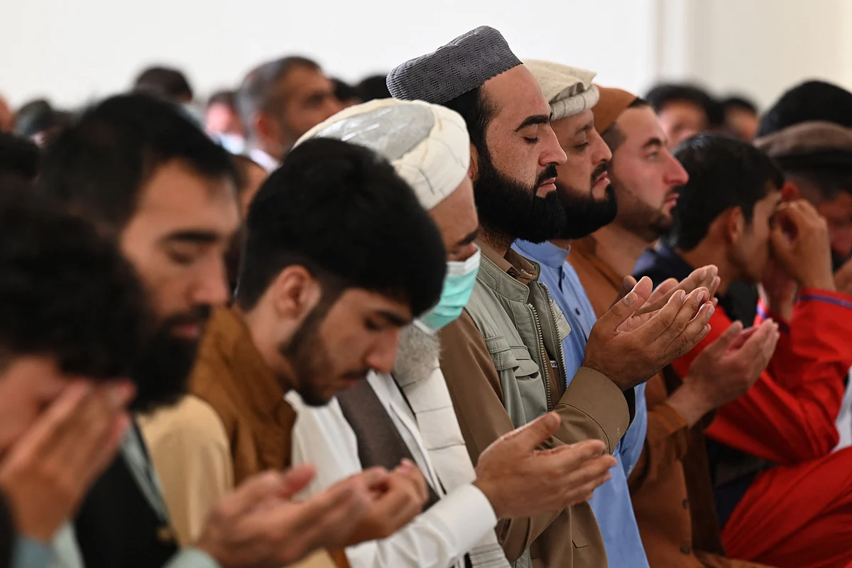 Afghan Muslim devotees offer their Eid al-Adha prayers inside a mosque in Kabul on July 20, 2021.