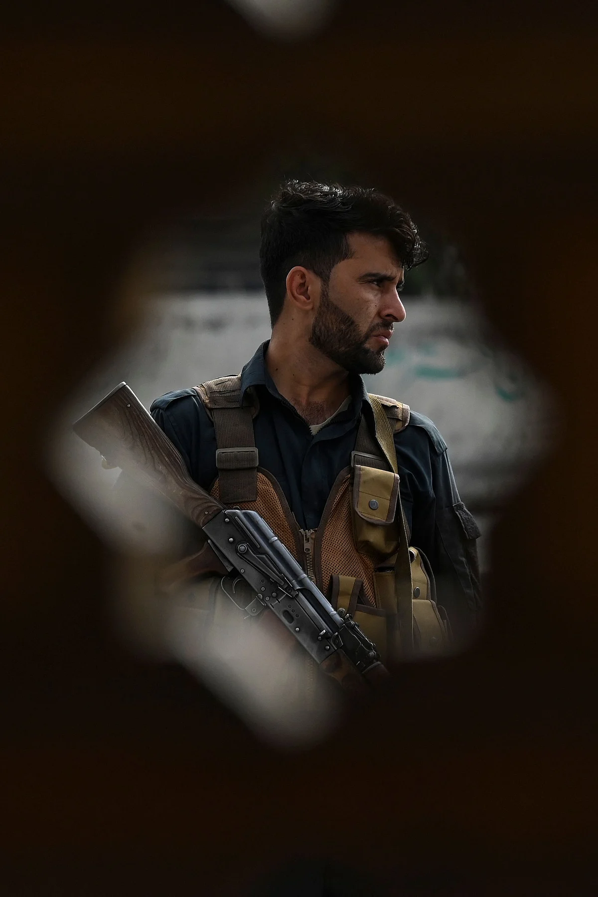 Afghan security personnel on alert outside a mosque during Eid-al-Adha prayers in Kabul on July 20, 2021.