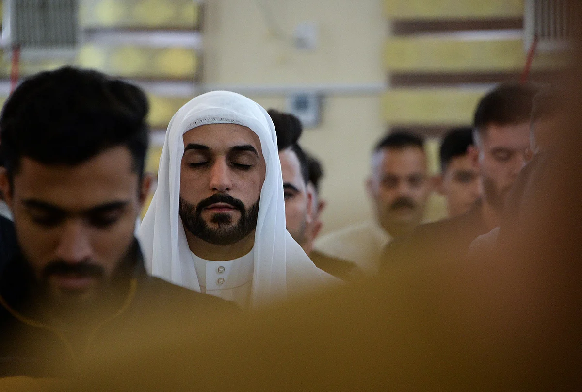 Iraqi worshippers perform the al-Adha feast prayers on the first day of the feast celebrated by Muslims worldwide, at the Mohammed Alamine mosque in the northern city of Mosul, on July 20, 2021.