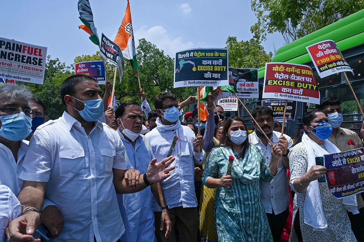 Indias Congress party supporters shout slogans against the Bharatiya Janata Party (BJP) led central government during a protest against the hike in fuel prices in New Delhi on July 7, 2021.