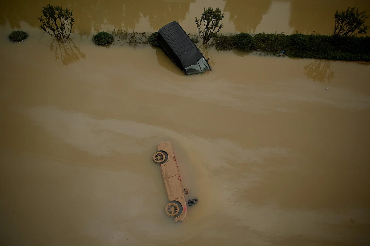 TOPSHOT - Cars sit in floodwaters following heavy rains, in Zhengzhou in Chinas central Henan province on July 22, 2021.