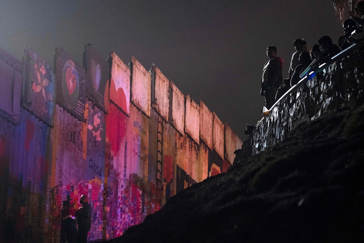People gather on the Mexican side of the US-Mexico border to watch the Independence Day fireworks being shot on the other side on the San Diego Bay, from Playas de Tijuana, Baja California state on July 4, 2021.
