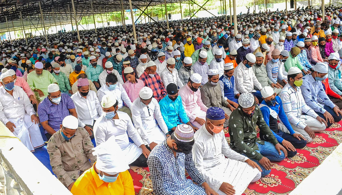 Muslims offer prayers at a market on the occasion of Eid al-Adha, in Coimbatore, Wednesday, July 21, 2021.