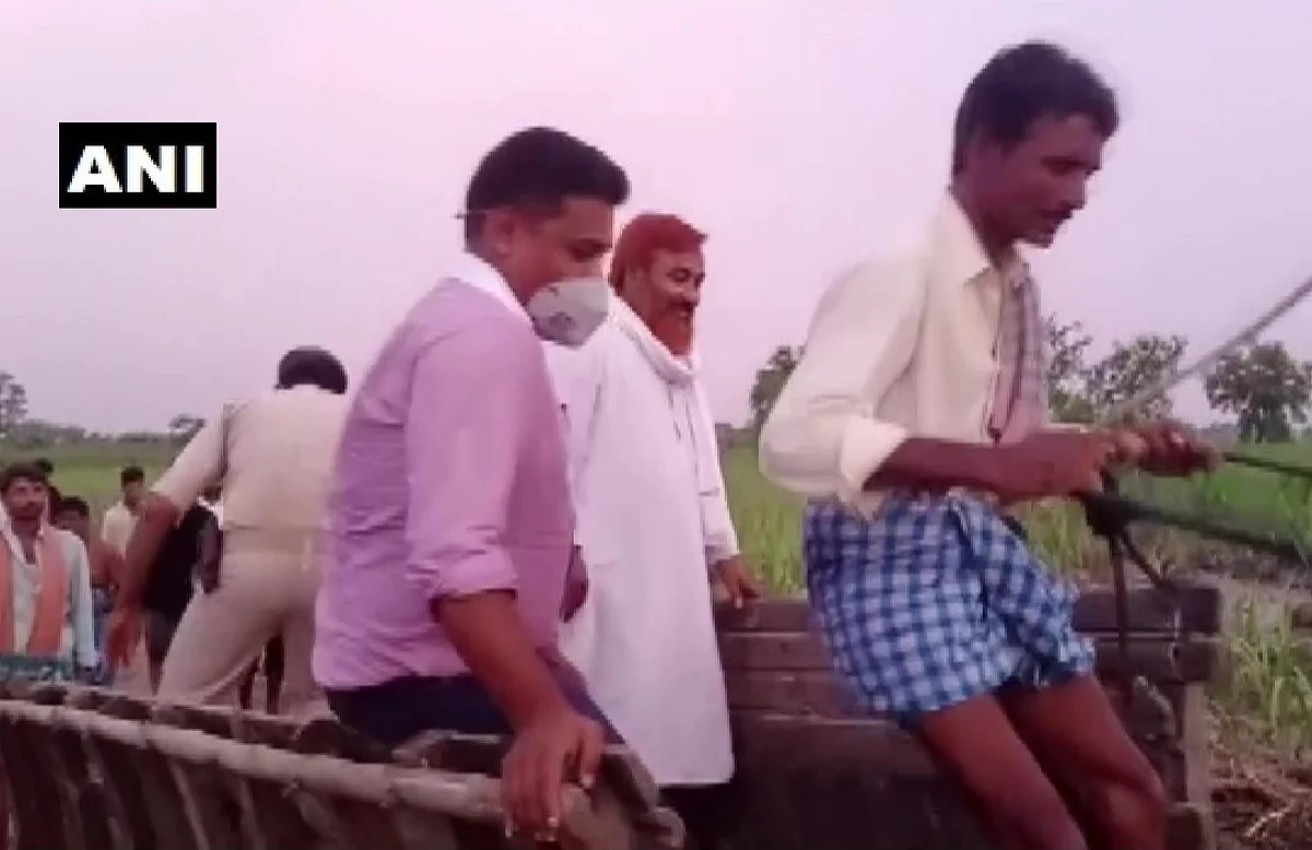 Bagaha SDM Shekhar Anand rode a buffalo cart to reach a river embankment in the flood-affected Ramnagar area in East Champaran, Bihar on July 5, 2021.