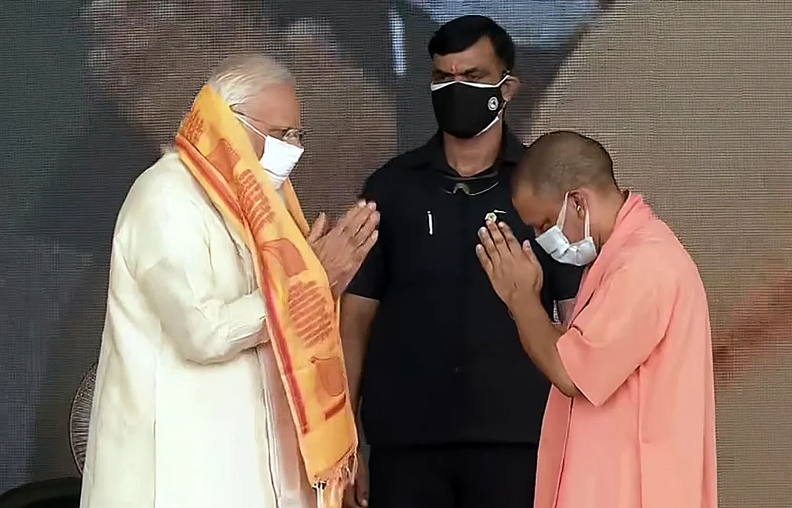 Uttar Pradesh Chief Minister Yogi Adityanath and Prime Minister Narendra Modi greet each other during the inauguration ceremony at Banaras Hindu University, in Varanasi on Thursday.