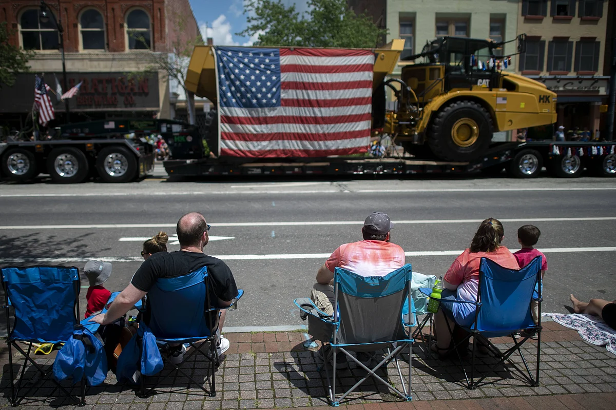 eople sit in chairs to observe a 4th of July parade on July 4, 2021 in Pottstown, Pennsylvania. Americans are resuming the celebrations of Independence Day as the COVID-19 pandemic lessens in severity.