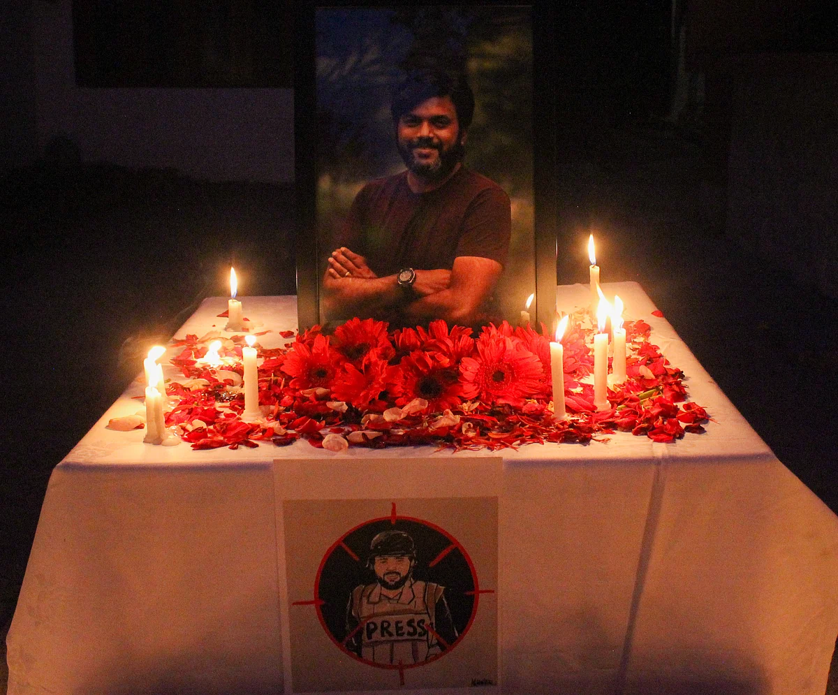 Candles are placed by journalists next to the portrait of Indian photojournalist Danish Siddiqui as a tribute inside the Kashmir Press Club in Srinagar, Jammu & Kashmir on July 18, 2021.