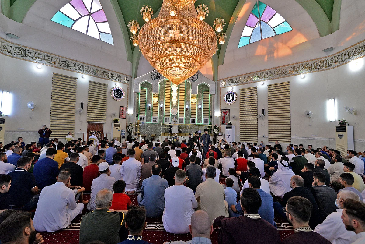 Iraqi worshippers perform the al-Adha feast prayers on the first day of the feast celebrated by Muslims worldwide, at the Mohammed Alamine mosque in the northern city of Mosul, on July 20, 2021.