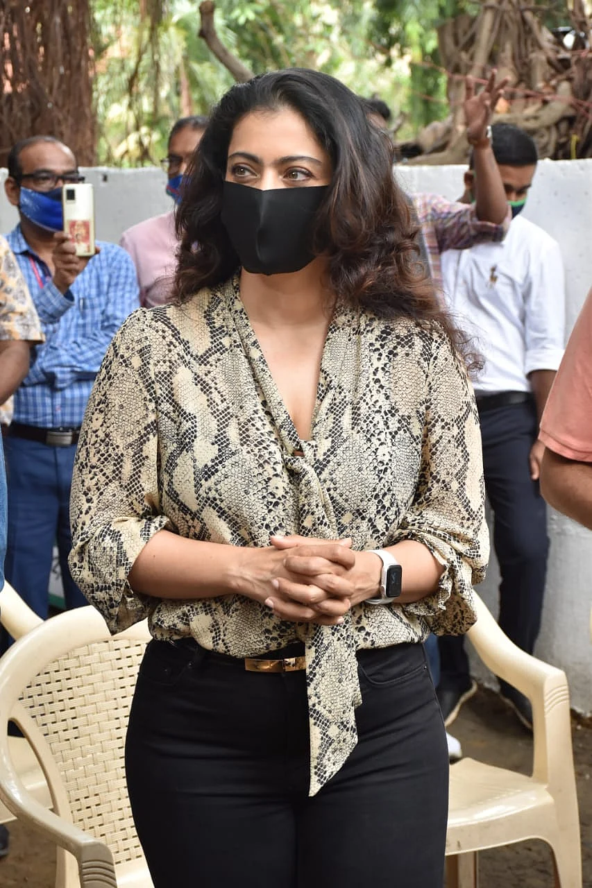 Watch: Kajol requests paparazzi to maintain social distancing as she steps out in Mumbai to distribute raincoats to BMC employees