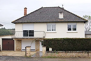 The house of a couple where the newborn child was locked in the trunk of a car for presumably over a year.