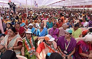 (Left) People patiently hear out the Congress scion at a rally in Bhiwandi on Thursday; (below) At Versova beach, Rahul speaks to the fisherfolk community.