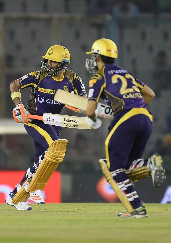 <strong>Kolkata Knight Riders batsman and captain Gautam Gambhir(R) and Robin Uthappa(L) run between the wickets during the 2016 Indian Premier League (IPL) Twenty20 cricket match between Kolkata Knight Riders and Kings XI Punjab at The Punjab Cricket Association Stadium in Mohali on April 19, 2016.</strong>