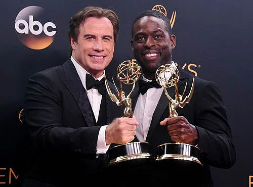 Actor John Travolta (L) and actor Sterling K. Brown