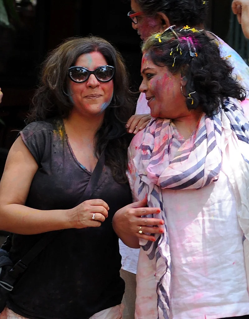 Indian Bollywood film director Zoya Akhtar (L) and actress Tanvi Azmi (R) take part in celebrations to mark the Hindu festival of Holi in Mumbai