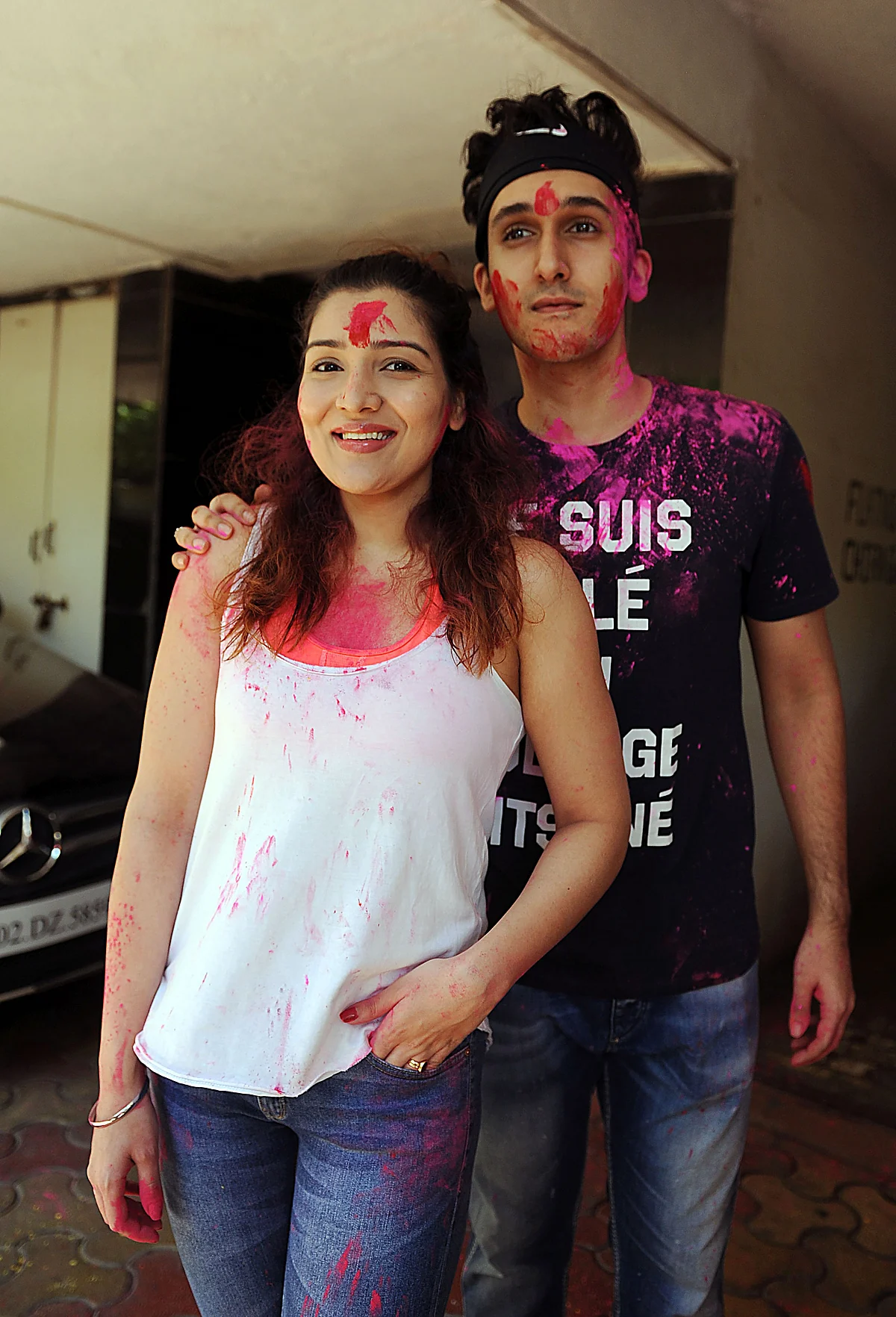 Indian Bollywood actress Tina Ahuja (L) and her brother Yashvardan Ahuja take part in celebrations to mark the Hindu festival of Holi in Mumbai