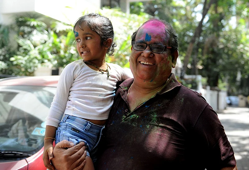 Indian Bollywood film director and actor Satish Kaushik takes part in celebrations to mark the Hindu festival of Holi in Mumbai