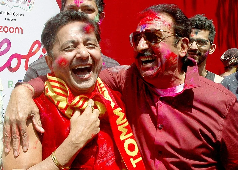 Bollywood actor Gulshan Grover and singer Sukhwinder Singh celebrating Holi Festival in Mumbai on Monday.