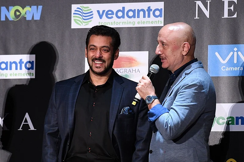 Bollywood actor Salman Khan (L) smiles as Anupam Kher speaks during a press conference ahead of the 18th International Indian Film Academy (IIFA) Festival, in New York, on July 13, 2017. / AFP PHOTO / ANGELA WEISS