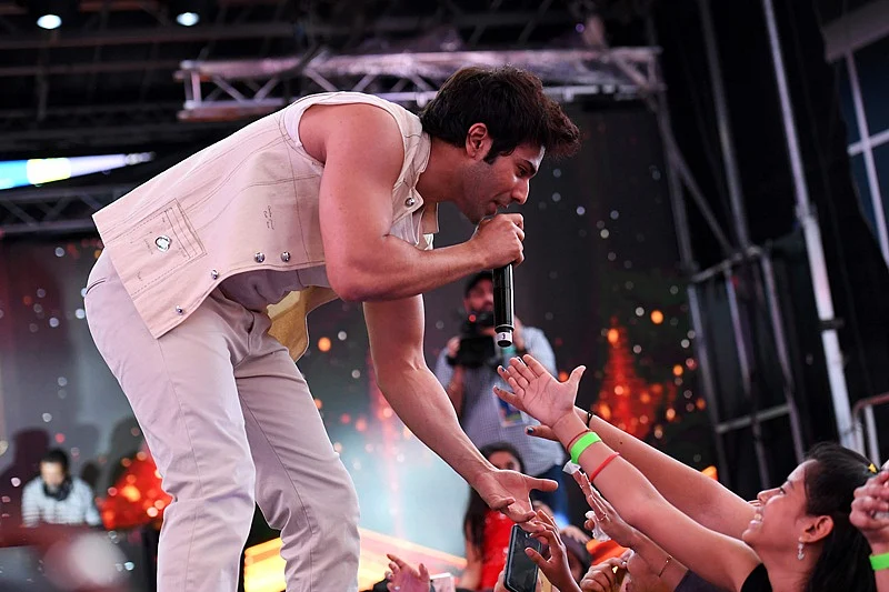 Bollywood actor Varun Dhawan performs during IIFA Stomp in the Times Square on July 13, 2017 to kick off the 18th International Indian Film Academy (IIFA) Festival in New York. / AFP PHOTO / ANGELA WEISS