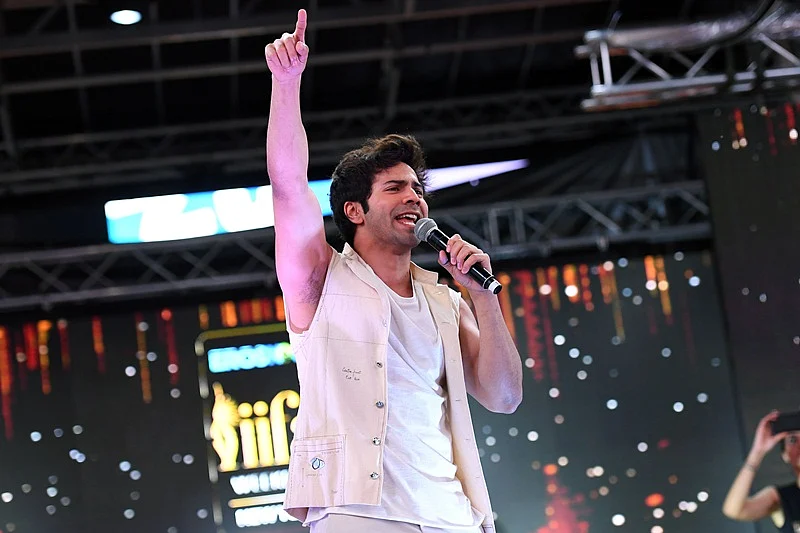 Bollywood actor Varun Dhawan performs during IIFA Stomp in the Times Square on July 13, 2017 to kick off the 18th International Indian Film Academy (IIFA) Festival in New York. / AFP PHOTO / ANGELA WEISS