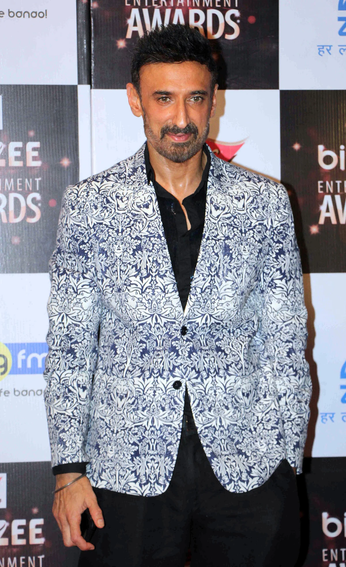 In this photograph taken on July 29, 2017, Indian Bollywood actor Rahul Dev attends the BIG ZEE Entertainment Awards 2017 ceremony in Mumbai. / AFP PHOTO / STR