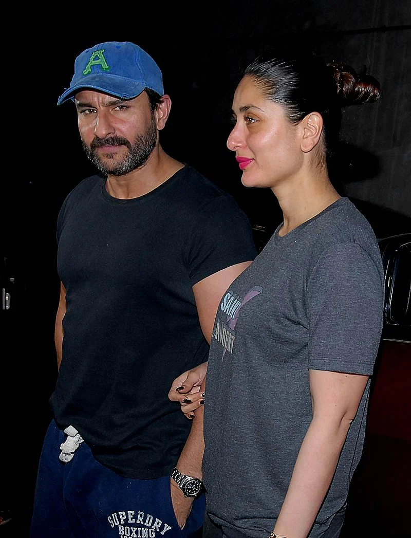 Indian Bollywood actors Saif Ali Khan with his wife Kareena Kapoor attend the special screening of upcoming comedy Hindi film ‘Kaalakaandi’ in Mumbai on January 9, 2018. / AFP PHOTO / Sujit Jaiswal