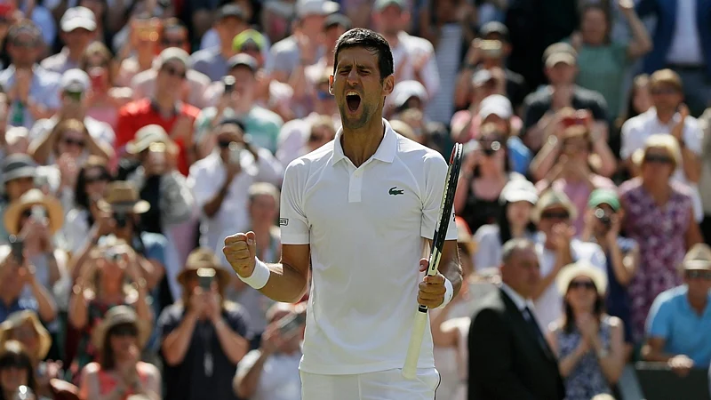 London :Novak Djokovic of Serbia celebrates defeating Kei Nishikori of Japan during their men’s quarterfinal match at the Wimbledon Tennis Championships in London, Wednesday July 11, 2018. AP/PTI Photo