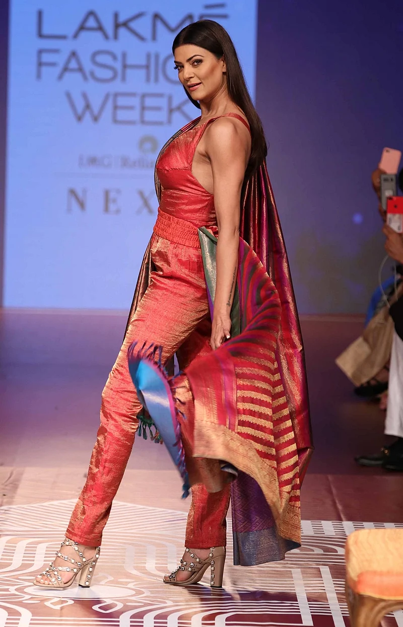 Mumbai: Bollywood actress Sushmita Sen walk ramp for RMKV Silks Re-Crafting traditional silks in collaboration with fashion designer Sunita Shankar during Lakme Fashion Week Winter/Festive 2018 in Mumbai on Thursday. Photo by BL SONI