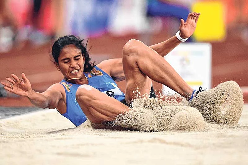 <em><strong>India’s Neena Varakil competes in the final of the long jump event</strong></em>