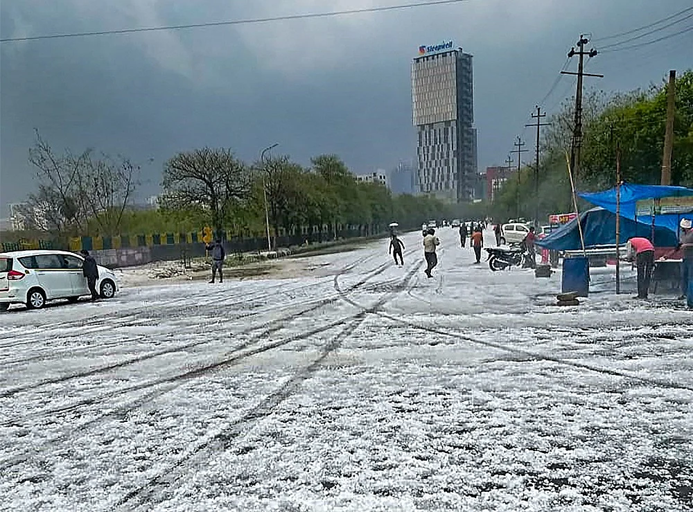 A view of a street after hailstorm struck various parts of Noida,<br />PTI Photo