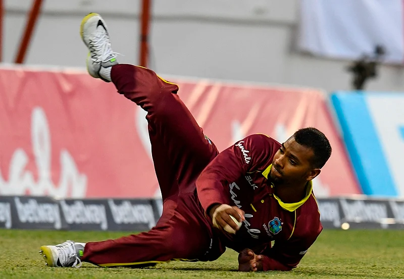 Nicholas Pooran fields a ball during a T20 match between the West Indies and England. Photo by Randy Brooks / AFP
