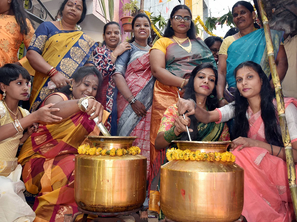 People perform traditional rituals during Pongal festival in Hubballi district, Thursday, Jan. 14, 2021.