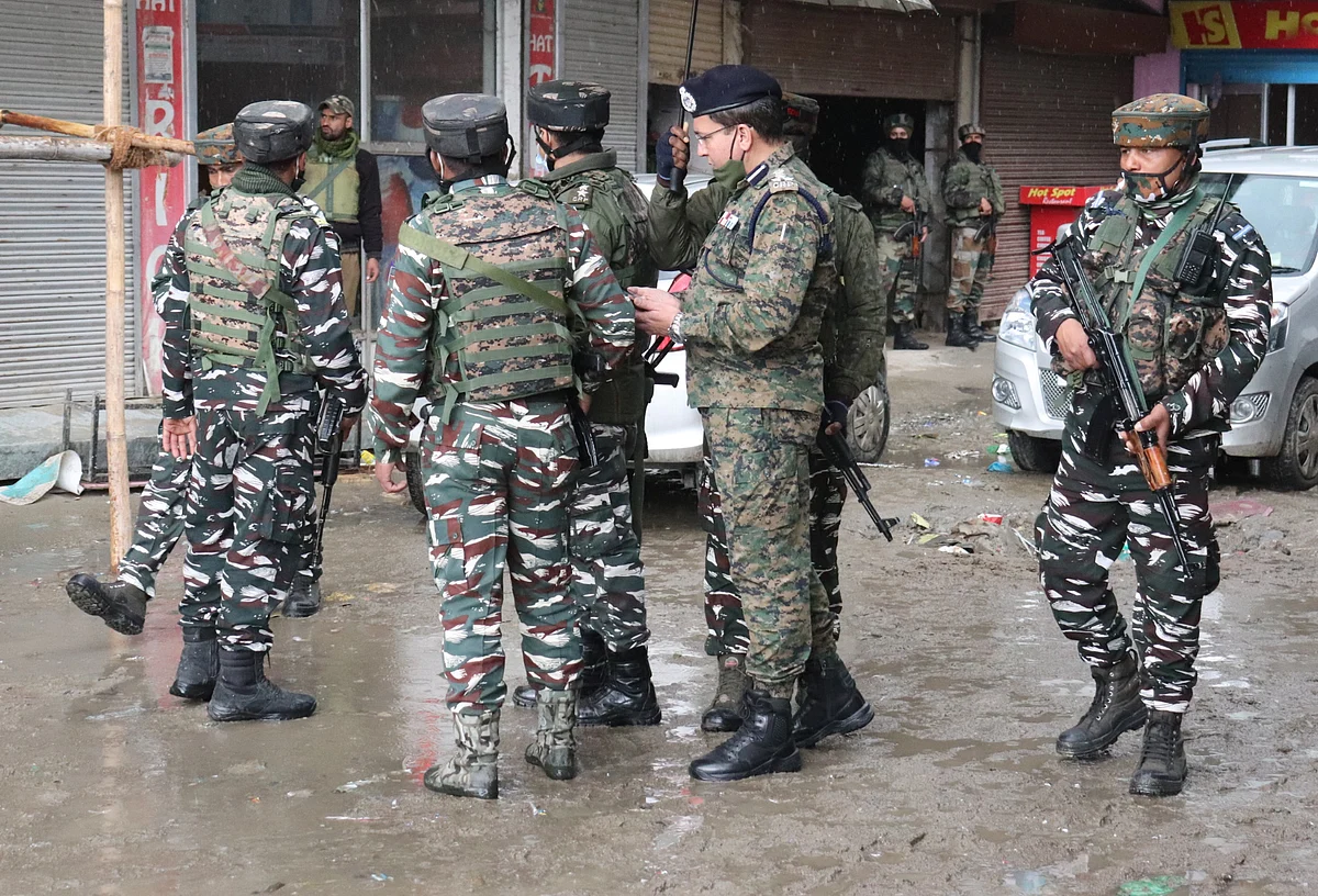 Security personnel arrive near the scene of a recent militant attack on Municipal councillor, at Sopore in North Kashmir.