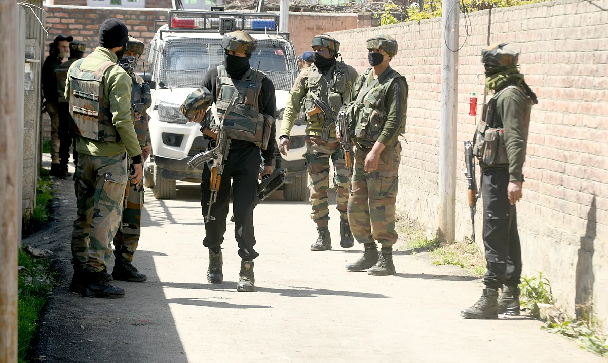 Senior security personnel arrive at the spot where suspected militants fired at BJP leader Anwar Khan’s residence in outskirts of Srinagar.