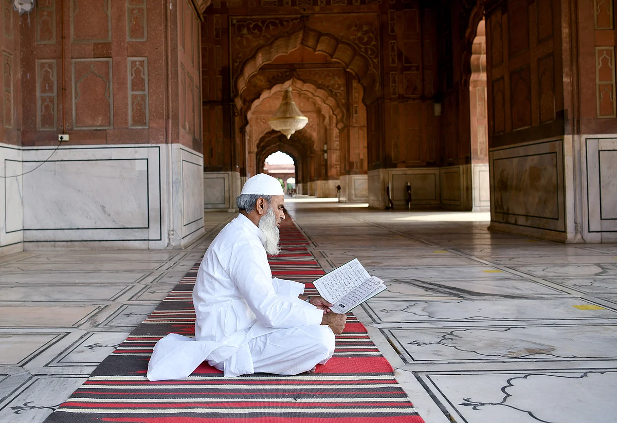 A Muslim devotee offer prayers outside the Jama Masjid mosque during Muslim?s Eid-al-Fitr festival marking the end of the holy fasting month of Ramadan amid the rise in COVID-19 cases, in New Delhi on Friday.