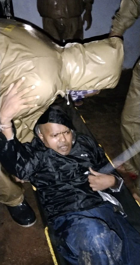 Jashipur fire station team rescue a paralysed man from his flooded house due to Cyclone storm Yaas, in Mayurbhanj, Odisha on Thursday.
