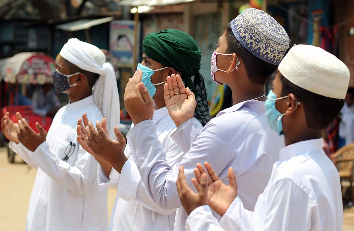 Muslim devotees offer prayers on the occasion of the Eid-ul-Fitr festival, which marks the end of the Islamic holy fasting month of Ramadan, the coronavirus pandemic in Agartala on Friday.