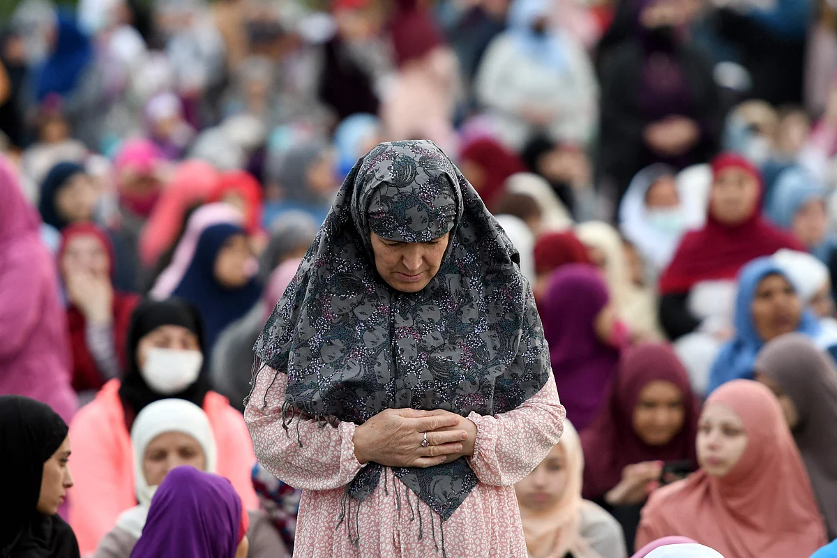 Albanian Muslim women prepare for the morning prayer at Skanderbeg square on the first day of the Muslim festival marking the end of the holy fasting month of Ramadan in Tirana on May 13, 2021.