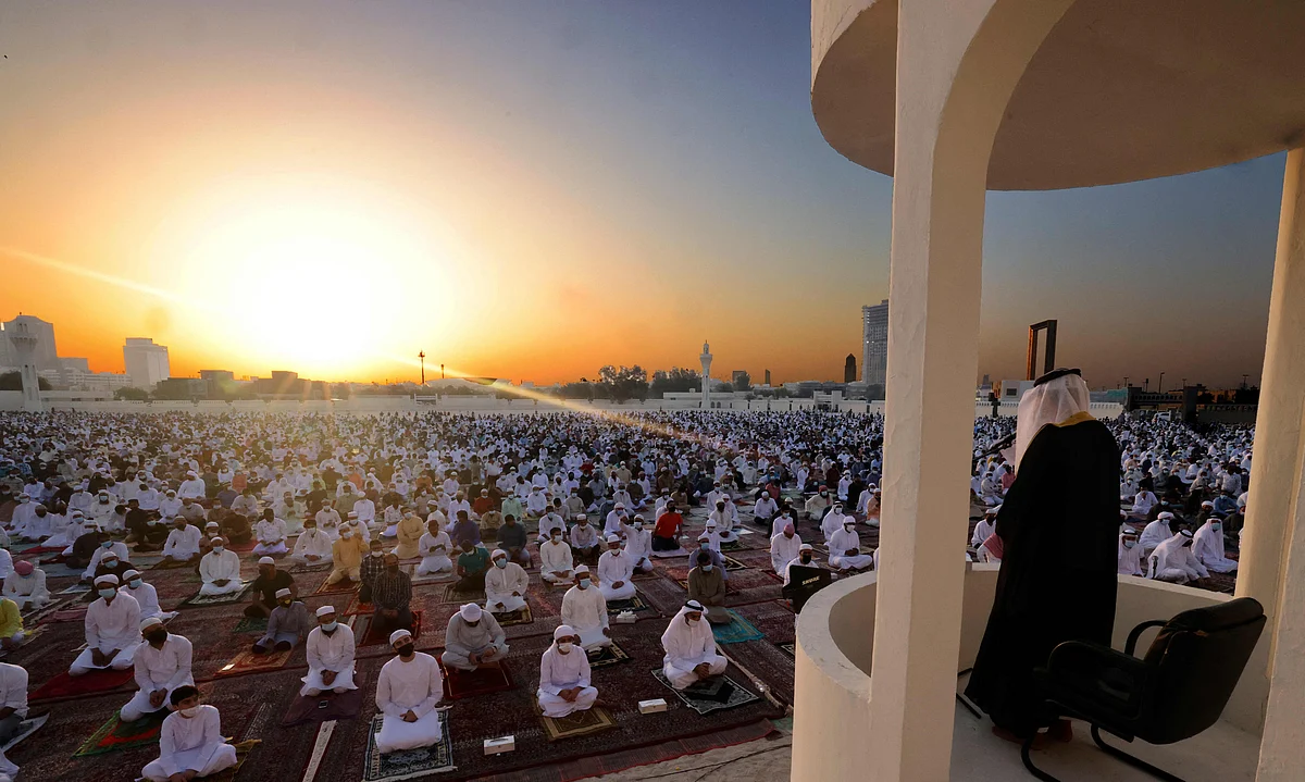 Muslim worshippers listen to the Eid al-Fitr morning prayer sermon at Dubai's Eid Musalla in the Gulf emirates old port area on May 13, 2021, as Muslims across the globe mark the end of the holy fasting month of Ramadan.