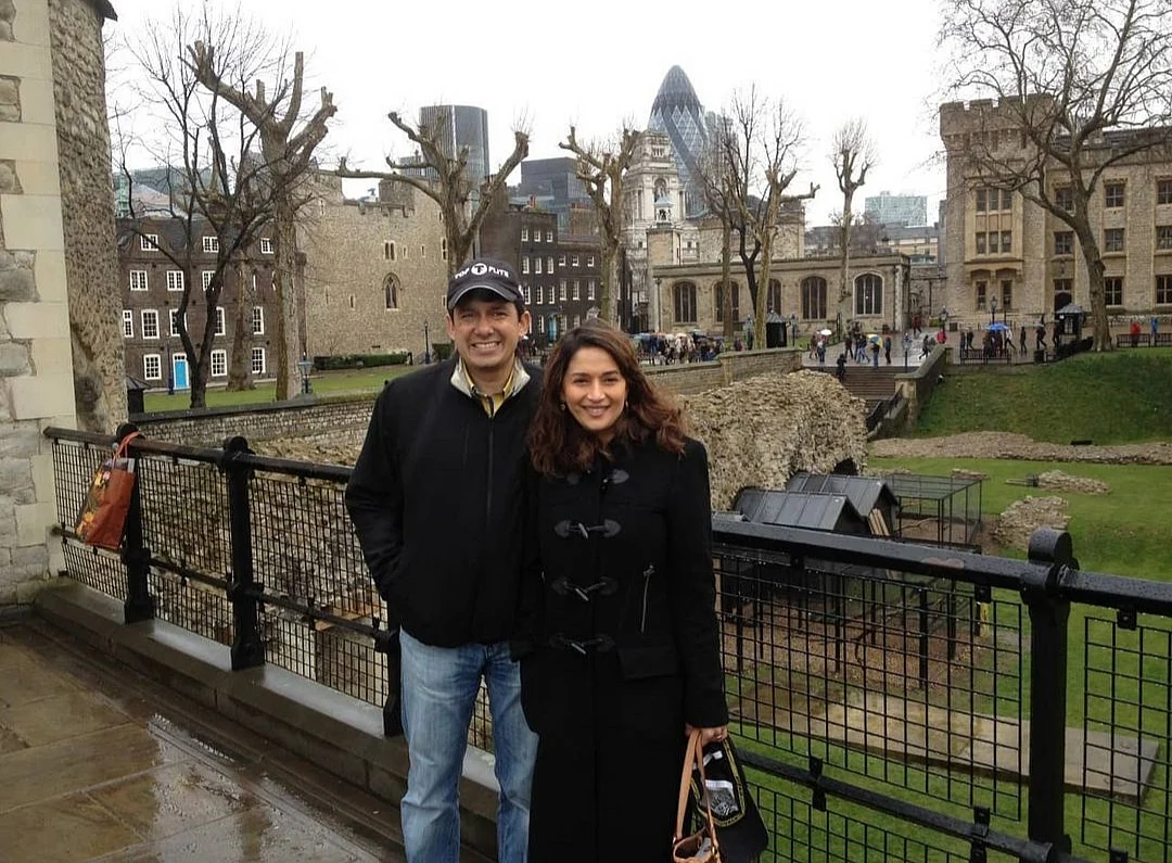 Madhuri and her husband all bundled up