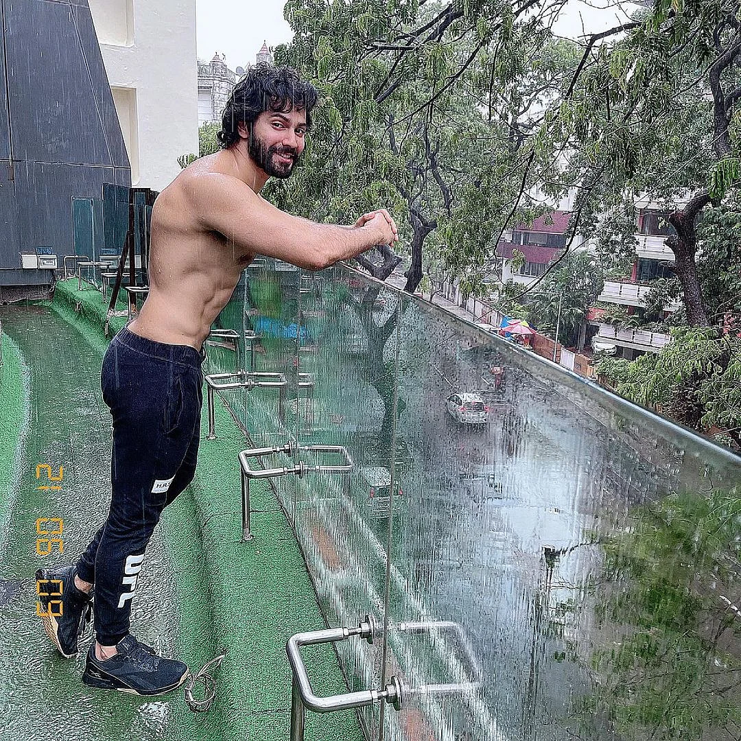 Varun Dhawan shares shirtless pic as he enjoys Mumbai rains; fans say 'baarish me aag laga di'