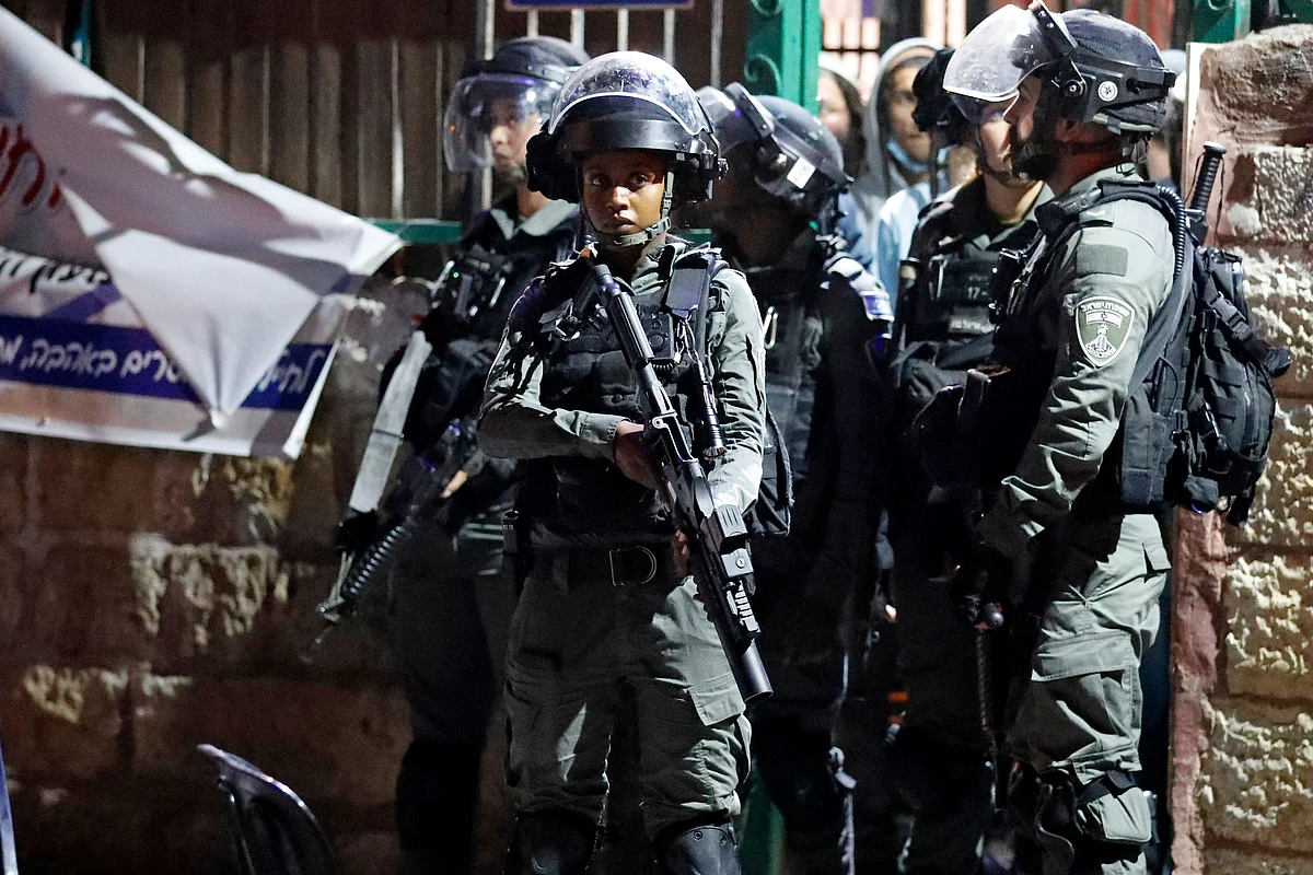 Israeli border guards stand at attention in the east Jerusalem neighbourhood of Sheikh Jarrah on June 21, 2021, during clashes between Israeli far-right extremists and Palestinians.