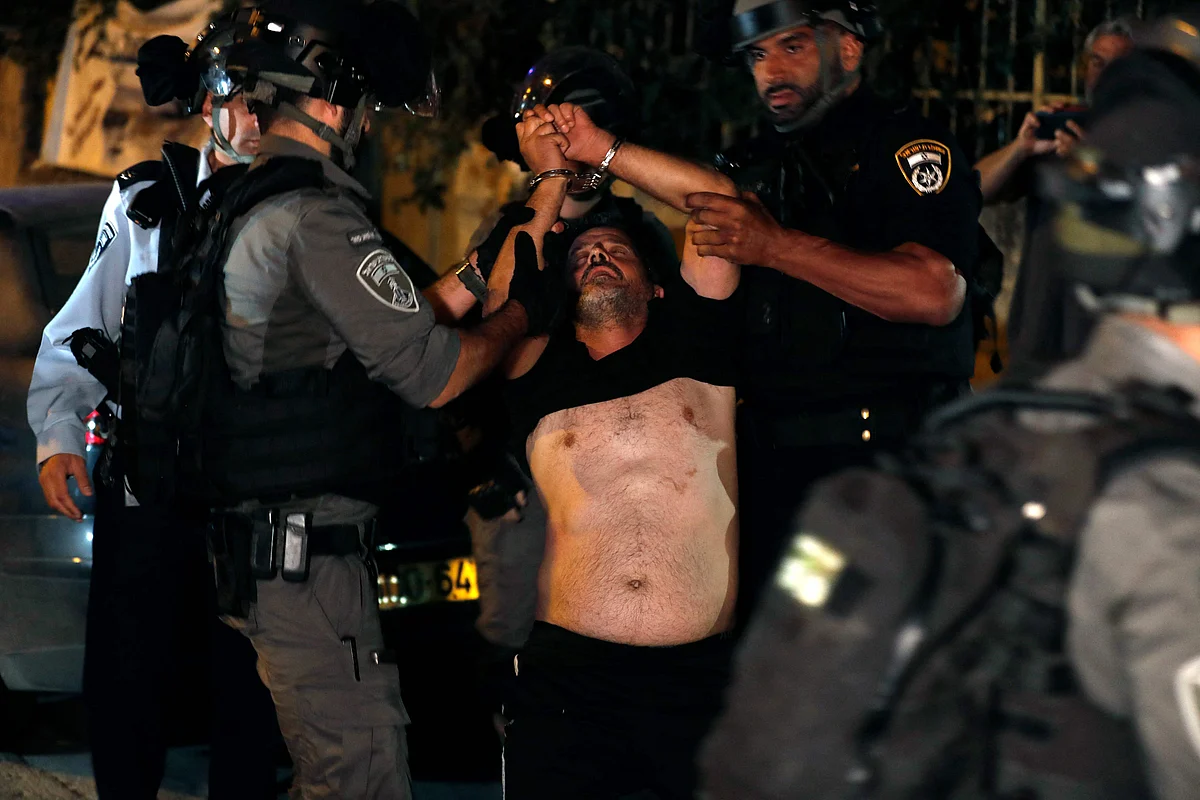A Palestinian demonstrator is arrested by Israeli security forces, as Palestinian families face eviction, part of an ongoing effort by Jewish Israelis to take control of homes in the Sheikh Jarrah neighbourhood of occupied east Jerusalem, on June 21, 2021.