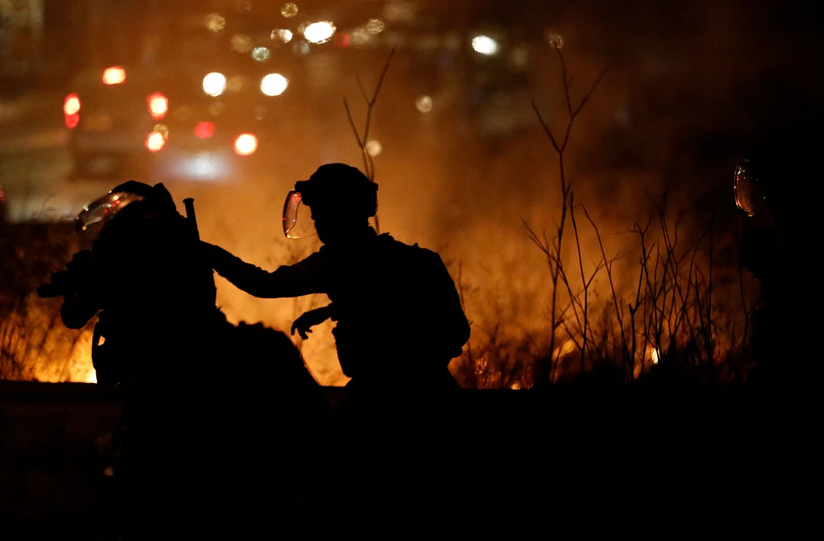 Israeli border guards stand at attention in the east Jerusalem neighbourhood of Sheikh Jarrah on June 21, 2021, during clashes between Israeli far-right extremists and Palestinians.