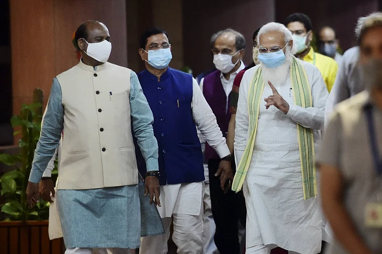 Prime Minister Narendra Modi with Lok Sabha Speaker Om Birla and TMC MP Sudip Bandyopadhyay after a meeting with leaders of the parties in Lok Sabha on the eve of monsoon session of Parliament, at Library building in New Delhi